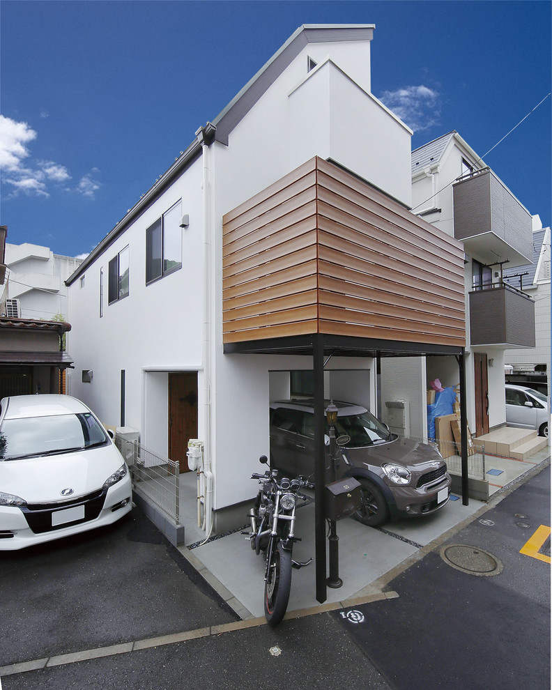 東京23区にあるお手頃価格の北欧スタイルのおしゃれな家の外観 (漆喰サイディング) の写真