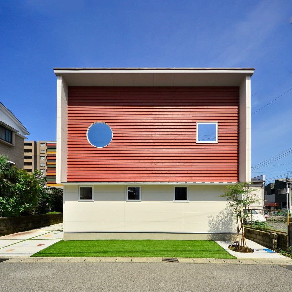 Exempel på ett modernt rött hus