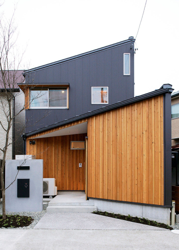 Ejemplo de fachada multicolor contemporánea con tejado de un solo tendido