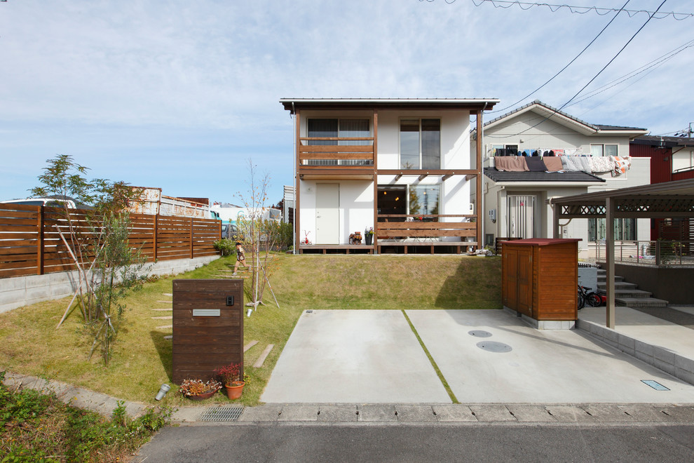 Kleines, Zweistöckiges Asiatisches Einfamilienhaus mit weißer Fassadenfarbe in Sonstige