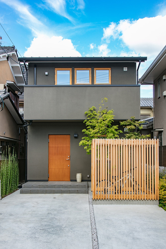 Ejemplo de fachada gris de estilo zen