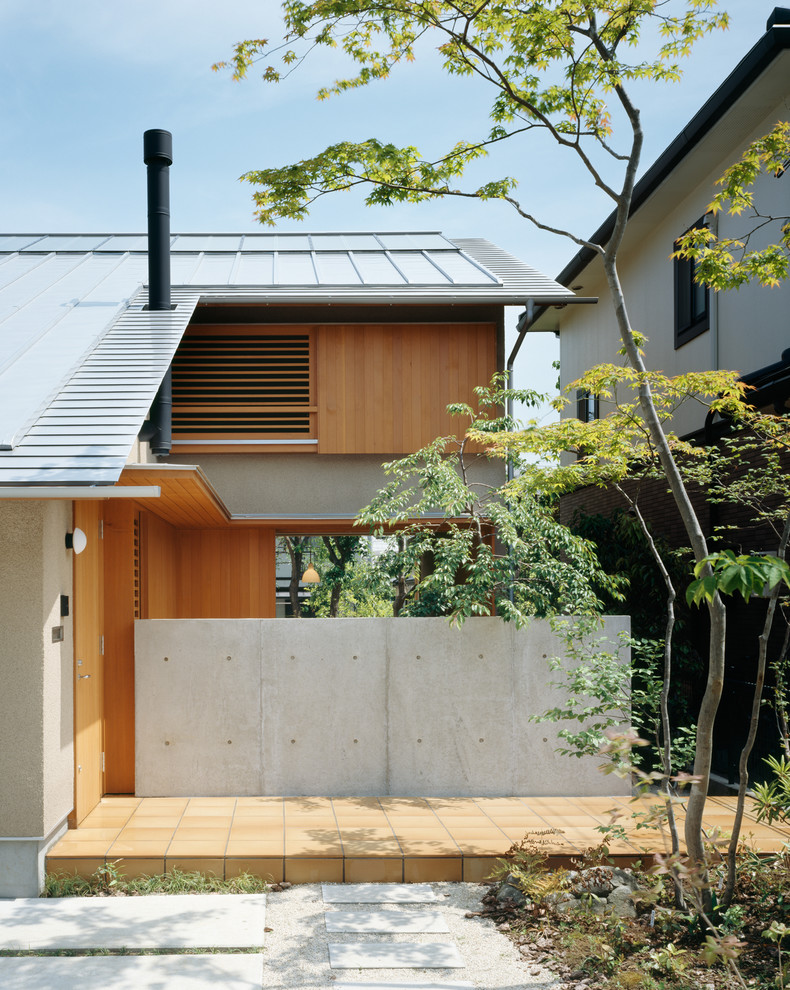 Diseño de fachada de estilo zen de dos plantas