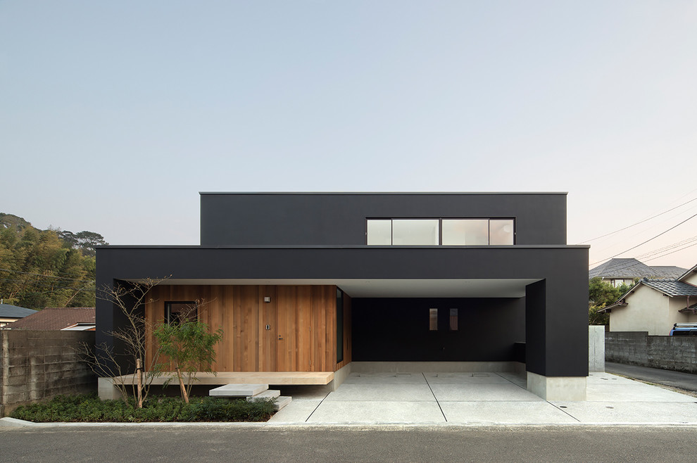 Diseño de fachada de casa negra minimalista grande de dos plantas con tejado de un solo tendido y tejado de metal