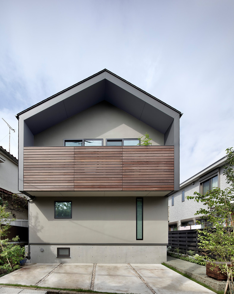 Inspiration for a small scandinavian multicolored three-story exterior home remodel in Tokyo with a metal roof