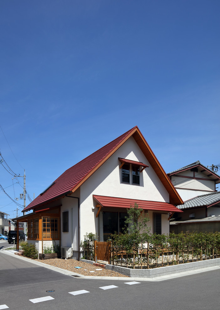大阪にあるカントリー風のおしゃれな家の外観の写真