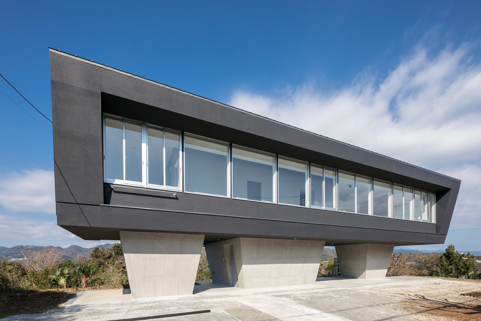 Inspiration för moderna grå hus, med platt tak
