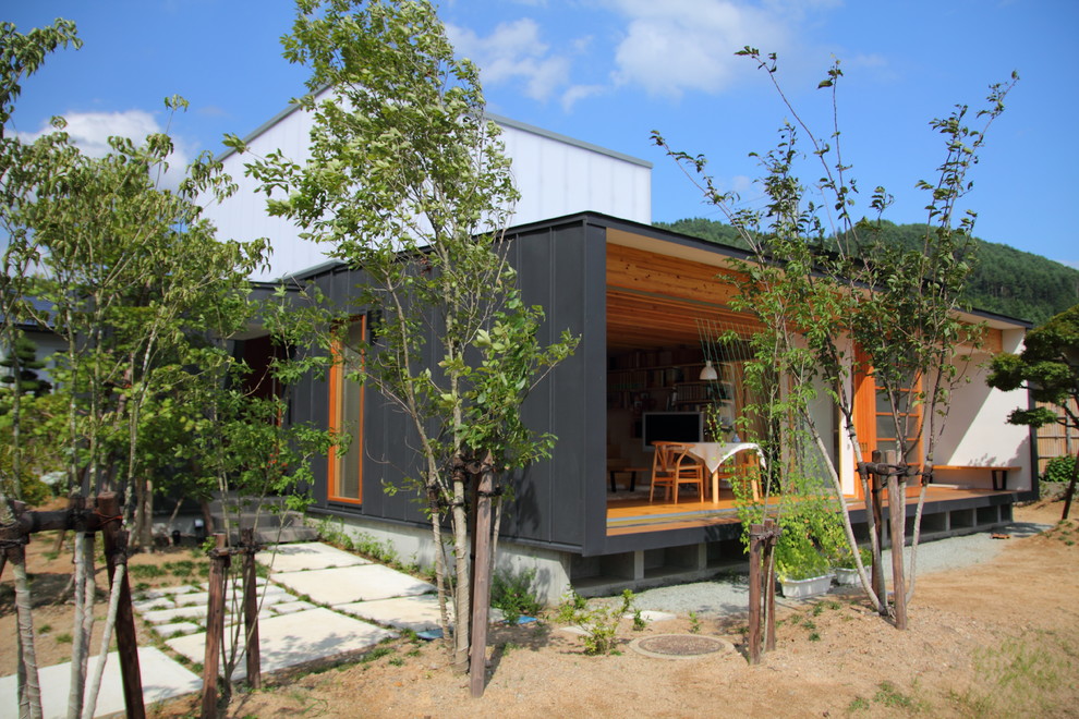 Example of a minimalist exterior home design in Other