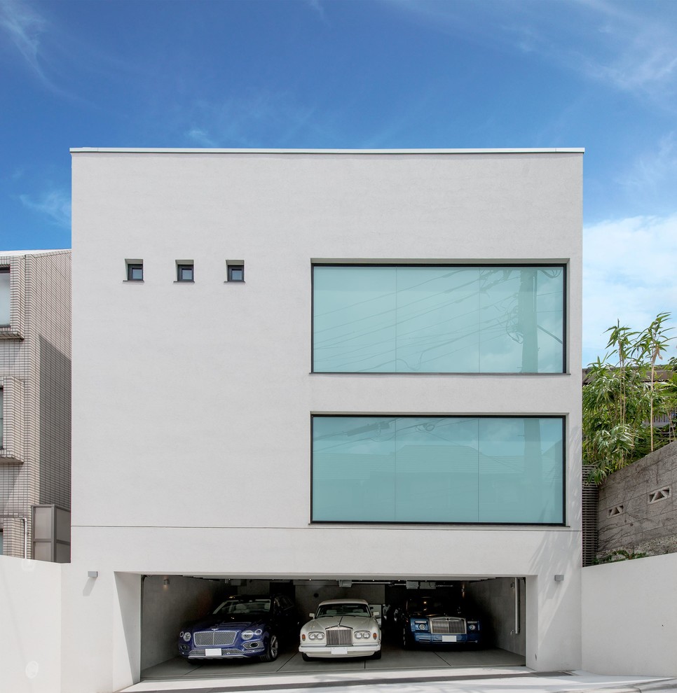 This is an example of a white contemporary house exterior with a flat roof.