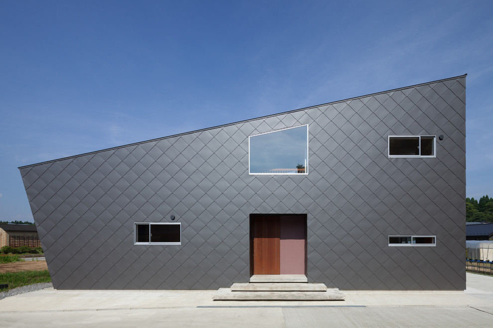 Стильный дизайн: черный дом в современном стиле с односкатной крышей - последний тренд