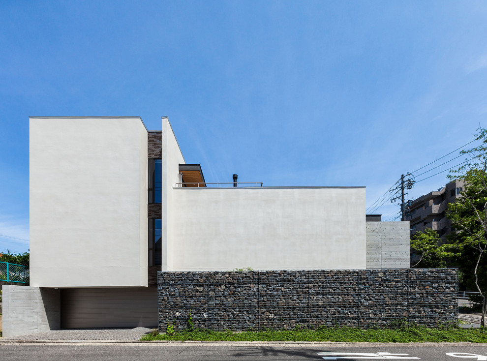 Idée de décoration pour une façade de maison minimaliste.