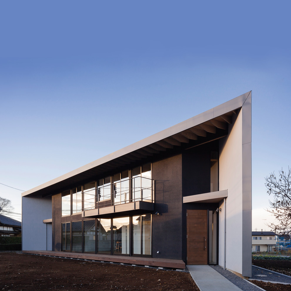 Idee per la facciata di una casa marrone contemporanea a due piani con tetto piano