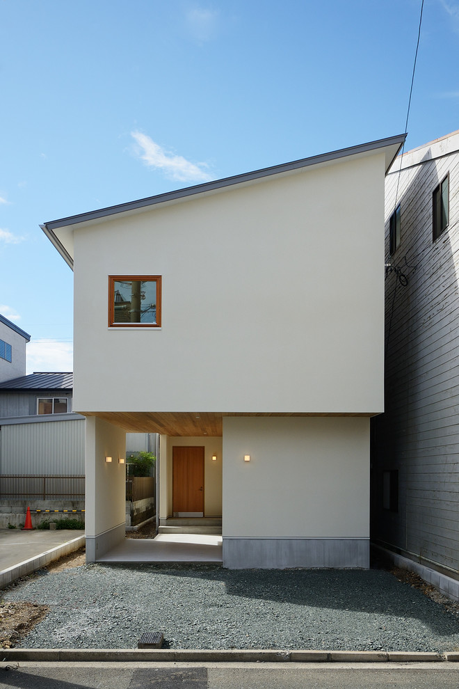 Inspiration for a white scandi two floor detached house in Other with a lean-to roof, a metal roof and a grey roof.