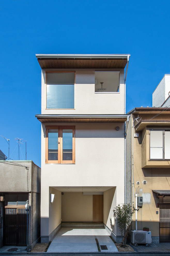 Photo of a small and white modern house exterior in Kyoto.
