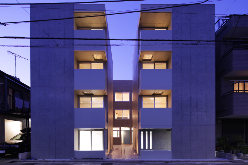 Cette image montre un grande façade d'immeuble minimaliste.