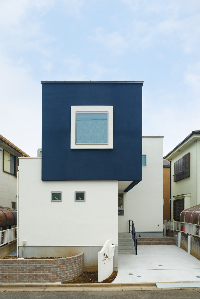 東京都下にあるお手頃価格の小さな北欧スタイルのおしゃれな家の外観の写真