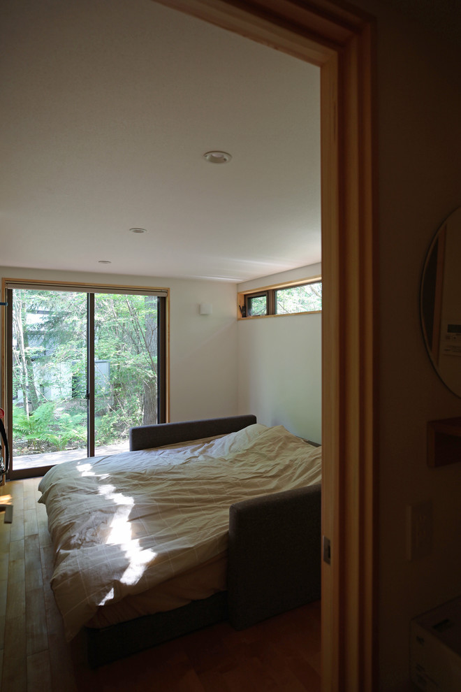 Example of a farmhouse master bedroom design