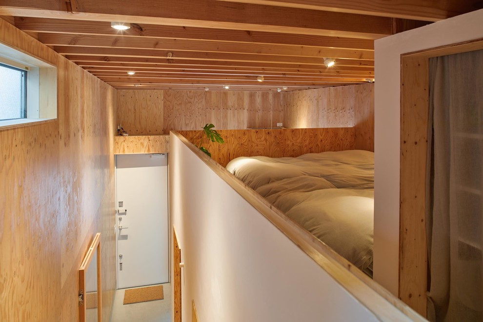 Immagine di una piccola camera da letto stile loft