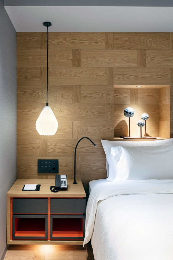 Inspiration for an expansive scandi guest bedroom in Osaka with brown walls, light hardwood flooring, no fireplace, brown floors, a wallpapered ceiling and wood walls.