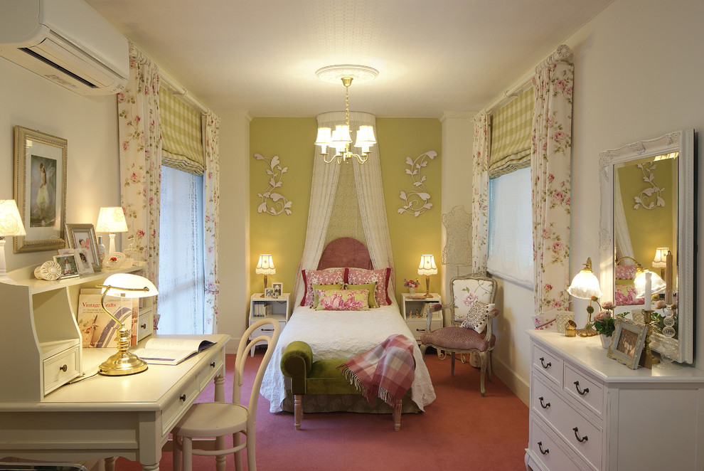 Elegant master carpeted and pink floor bedroom photo in Other with white walls
