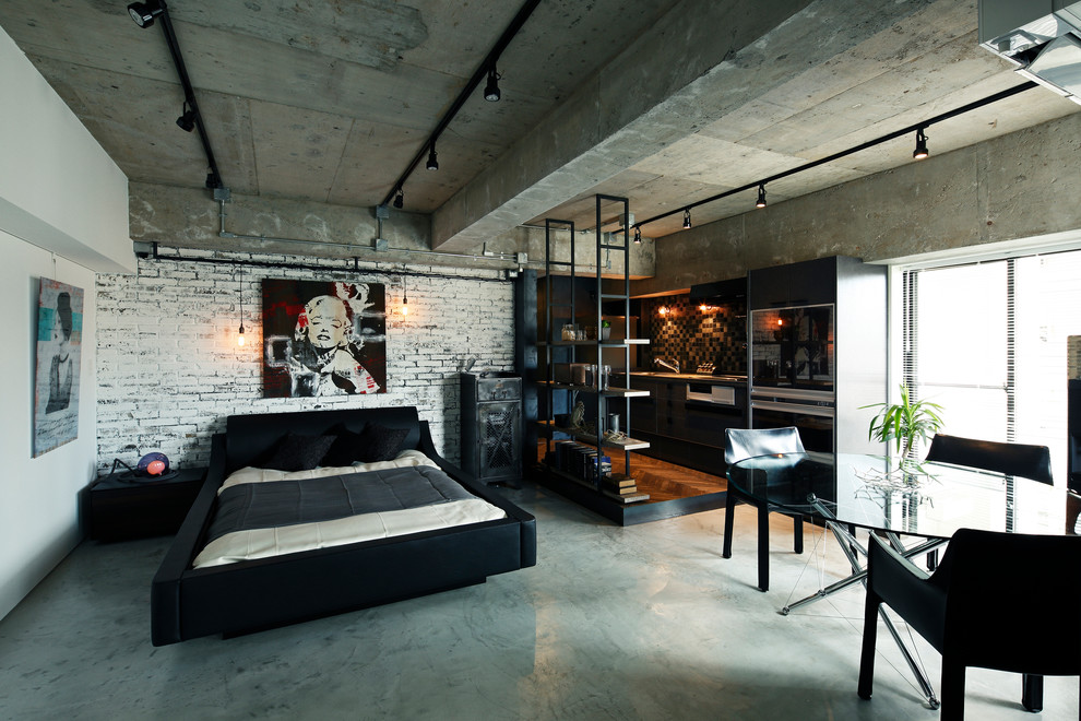 Foto di una camera da letto industriale con pareti bianche