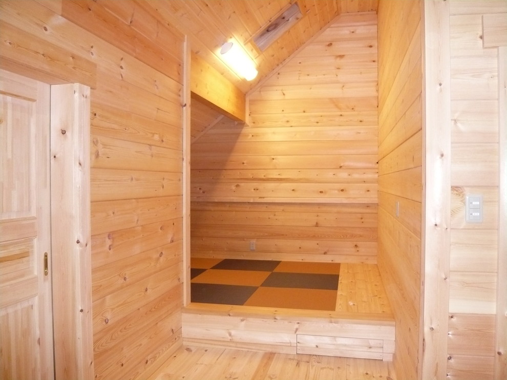 Ispirazione per una camera da letto stile loft scandinava con pavimento in tatami