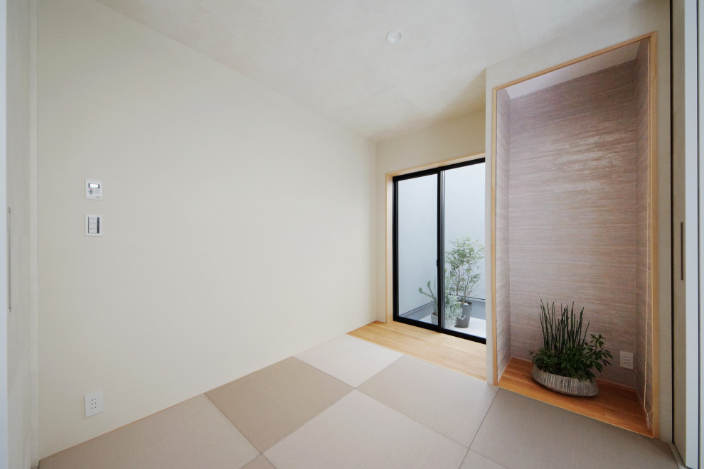 Modelo de habitación de invitados minimalista con paredes blancas, tatami y suelo gris