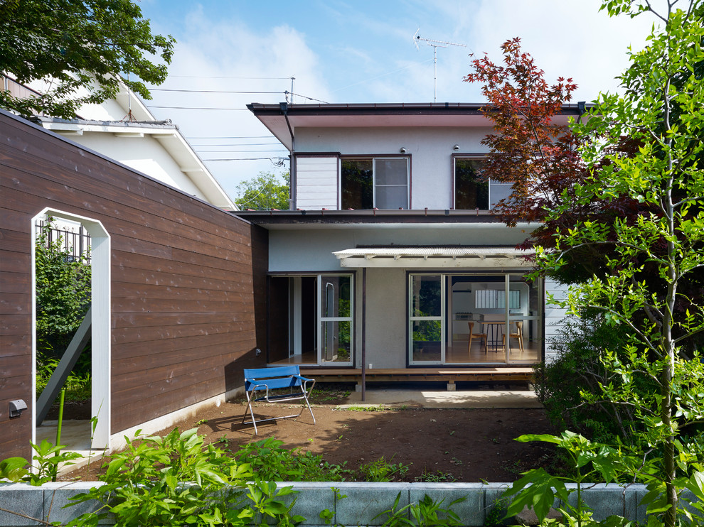Photo of a world-inspired back full sun pergola for spring in Tokyo Suburbs with a garden path.