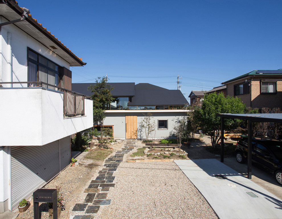 Foto de jardín de estilo zen en patio delantero con jardín francés y exposición total al sol