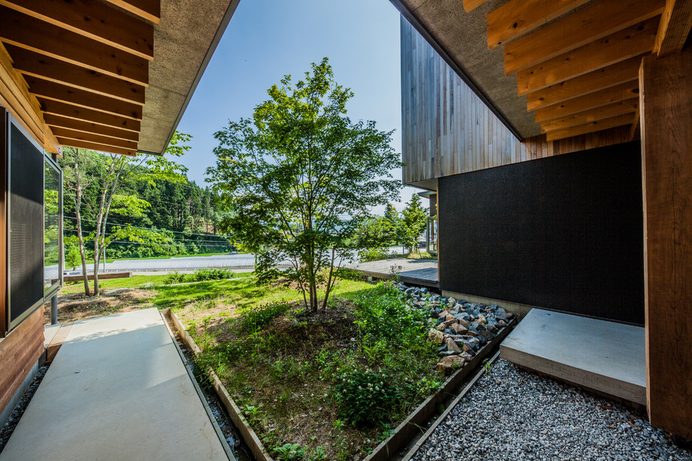Modelo de jardín de estilo zen de tamaño medio en patio con exposición parcial al sol