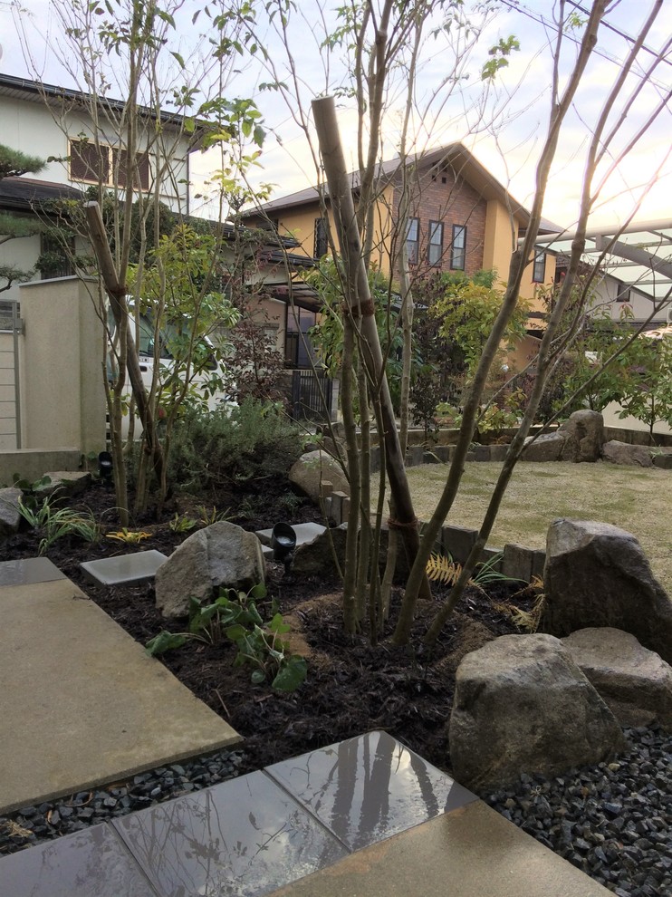 Design ideas for an asian full sun front yard landscaping in Other.