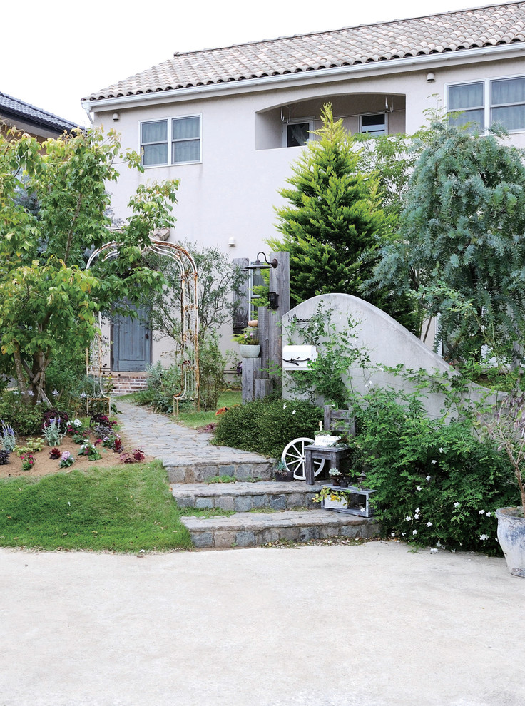 This is an example of a transitional front yard landscaping in Other.