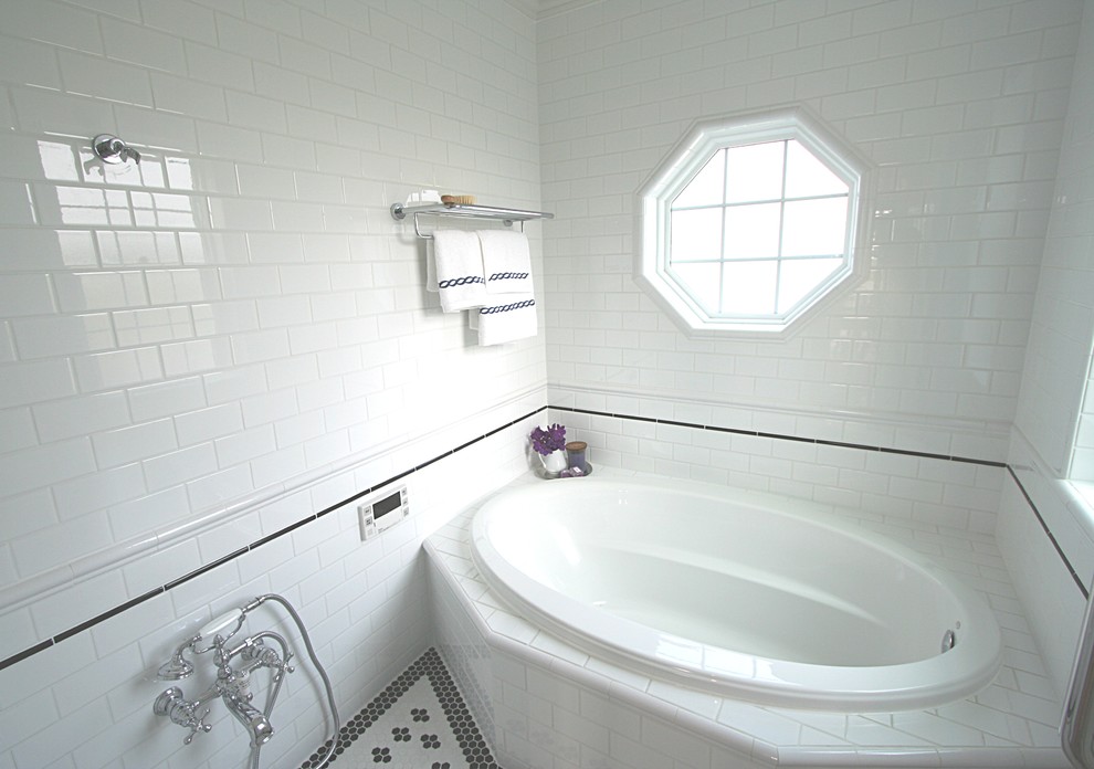 Elegant white tile and subway tile bathroom photo in Other