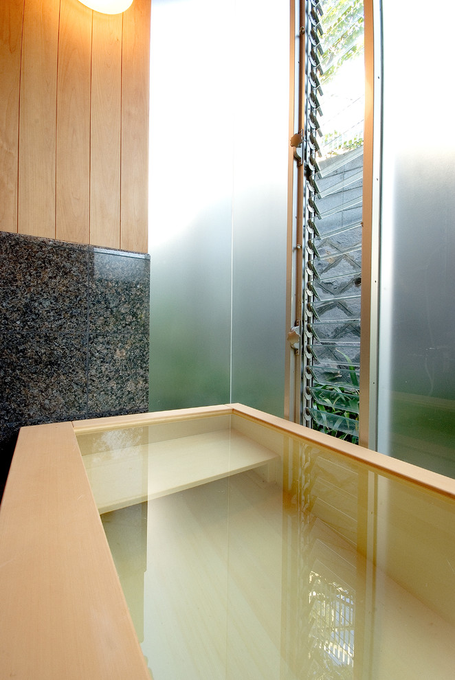 Inspiration for a world-inspired bathroom in Other with a japanese bath.