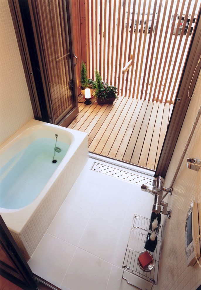 This is an example of a small contemporary ensuite wet room bathroom in Tokyo with a built-in bath, white tiles, mosaic tiles, white walls, ceramic flooring, white floors and an open shower.