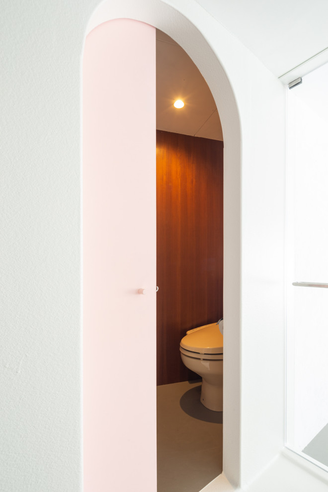 This is an example of a medium sized contemporary wet room bathroom in Tokyo with white cabinets, a claw-foot bath, a two-piece toilet, white tiles, white walls, white floors, a hinged door, a single sink, a freestanding vanity unit, a timber clad ceiling and tongue and groove walls.
