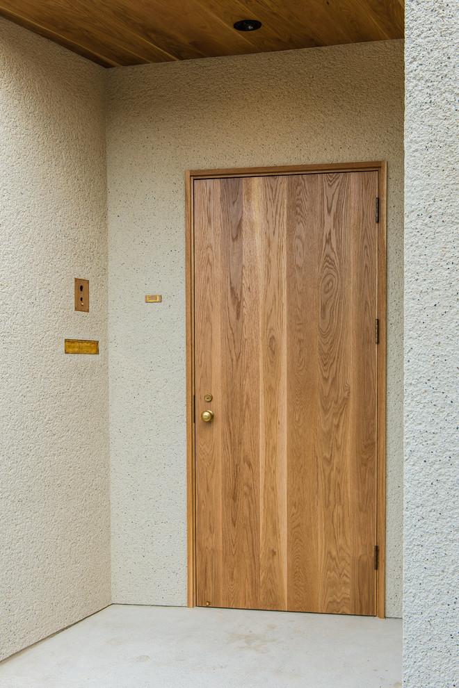 他の地域にあるインダストリアルスタイルのおしゃれな玄関の写真