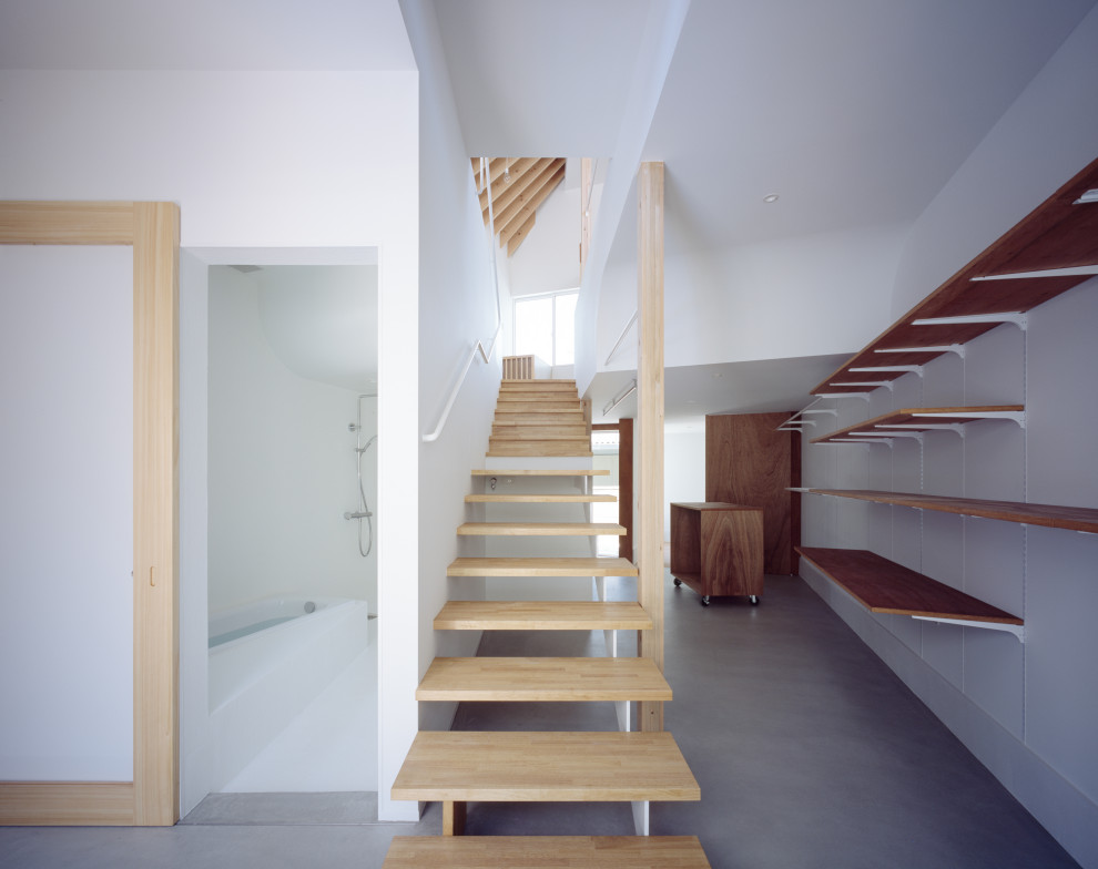 Design ideas for a medium sized modern entrance in Tokyo Suburbs with white walls, light hardwood flooring, brown floors, exposed beams, tongue and groove walls, a sliding front door and a grey front door.
