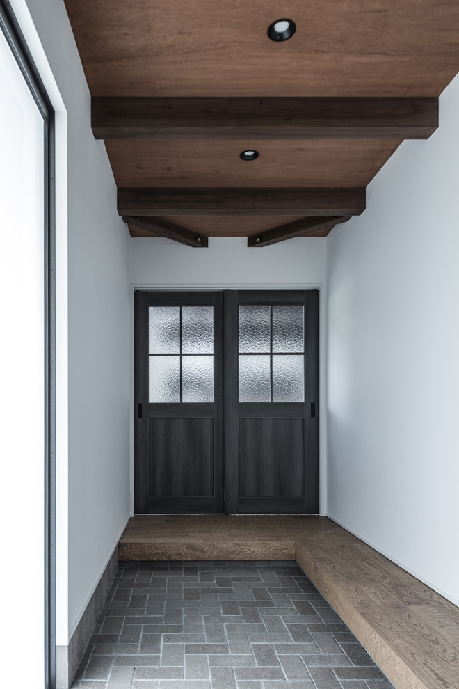 Mid-sized island style single front door photo in Osaka with white walls and a black front door