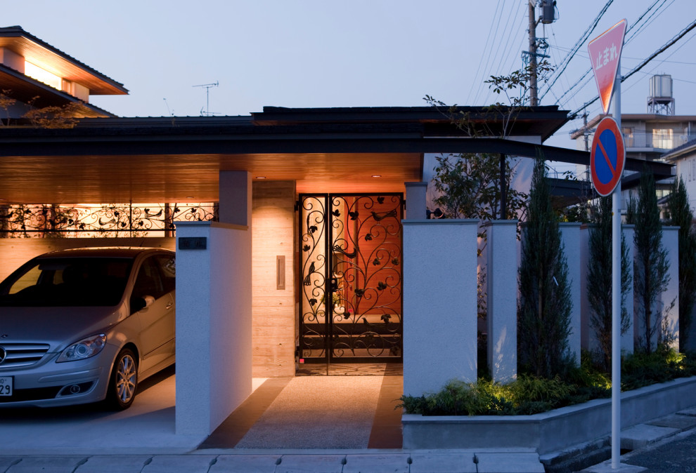 Idee per un grande ingresso minimalista con pareti grigie, una porta singola, una porta in legno bruno, pavimento grigio e pavimento in granito
