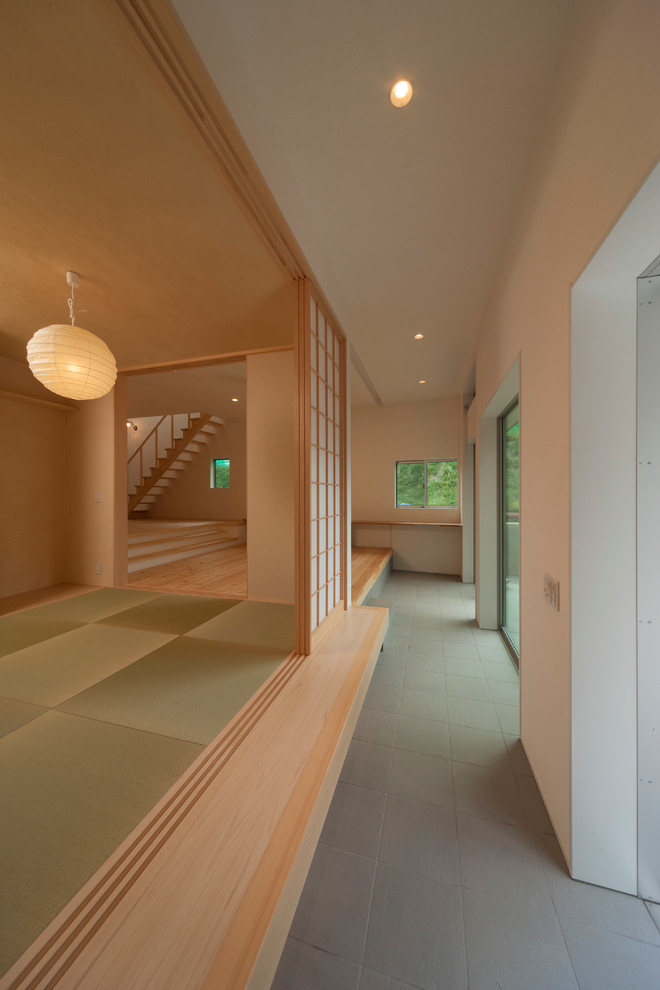 World-inspired entrance in Tokyo with grey floors.