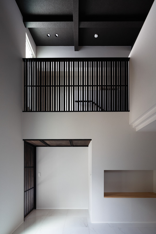 На фото: огромная узкая прихожая в стиле модернизм с белыми стенами, полом из керамогранита, двустворчатой входной дверью, коричневой входной дверью и белым полом