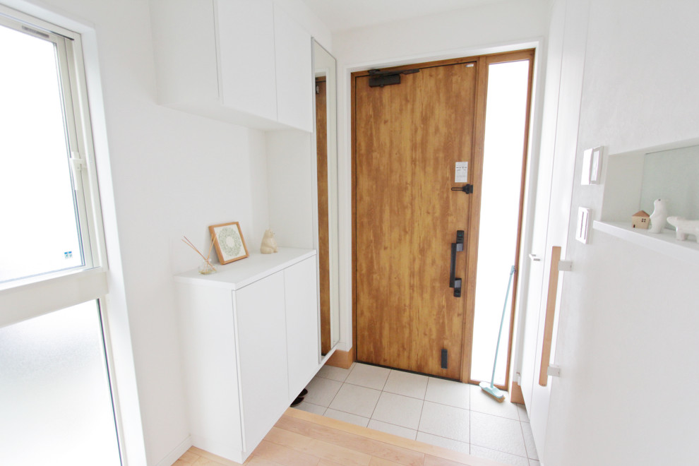 Design ideas for a medium sized scandinavian boot room in Tokyo Suburbs with white walls, a single front door, a medium wood front door, porcelain flooring and grey floors.