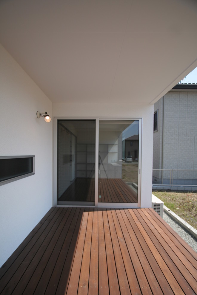 Inspiration pour un porche d'entrée de maison minimaliste.