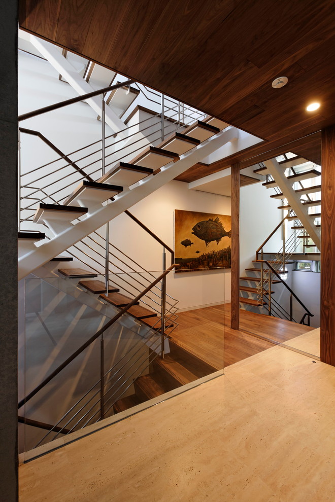 Aménagement d'un escalier sans contremarche contemporain en U avec des marches en bois et palier.