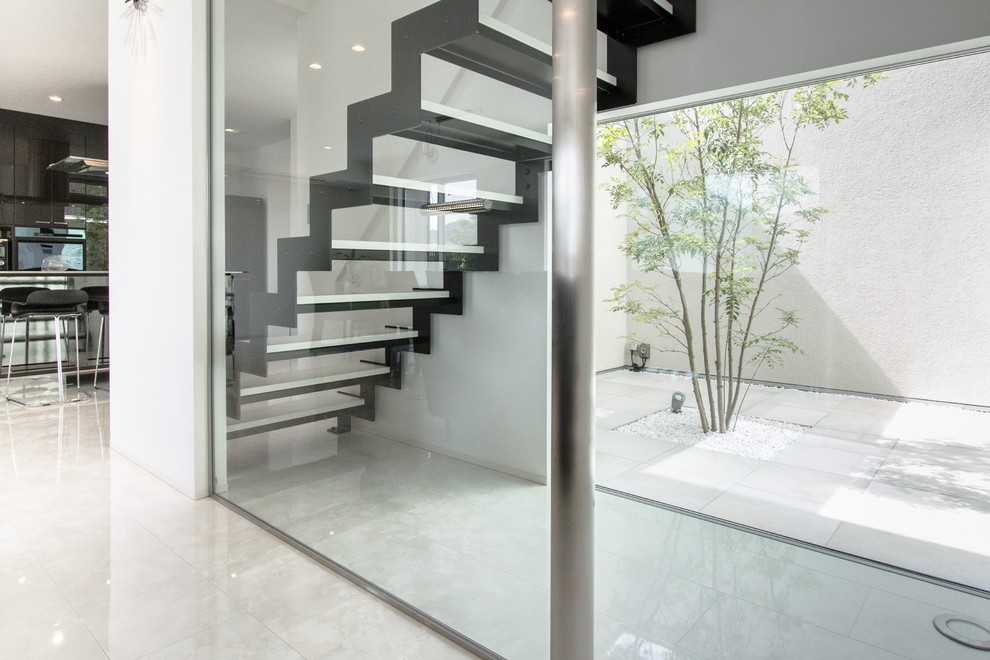 Staircase - contemporary straight open staircase idea in Other