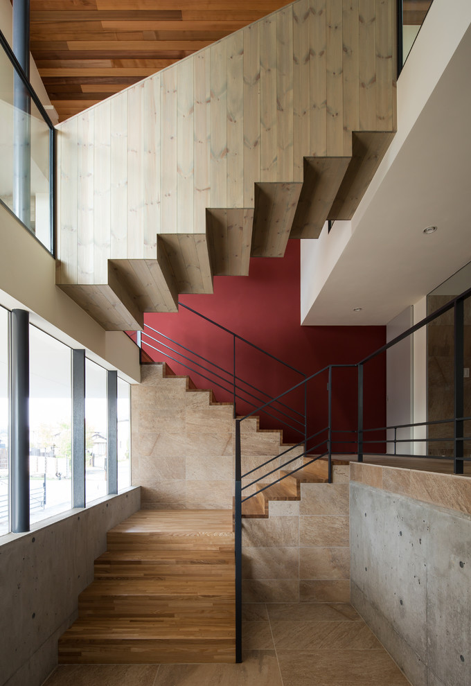 Foto de escalera en L minimalista con escalones de madera y contrahuellas de madera