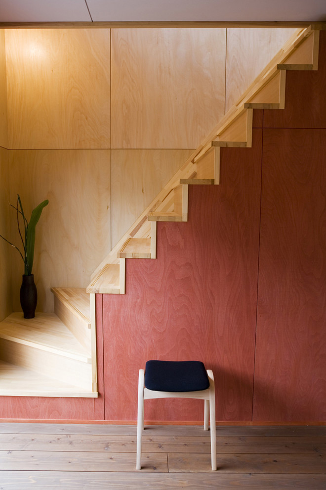 Inspiration for an asian wooden straight staircase remodel in Fukuoka with wooden risers