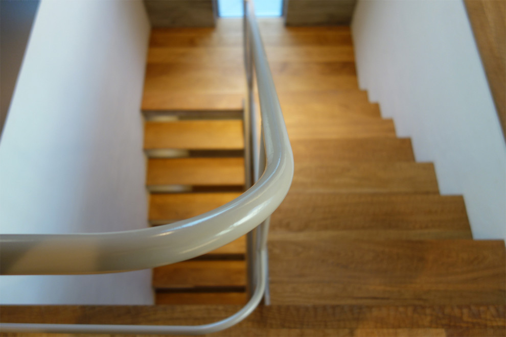 Staircase - modern wooden u-shaped open staircase idea in Tokyo Suburbs