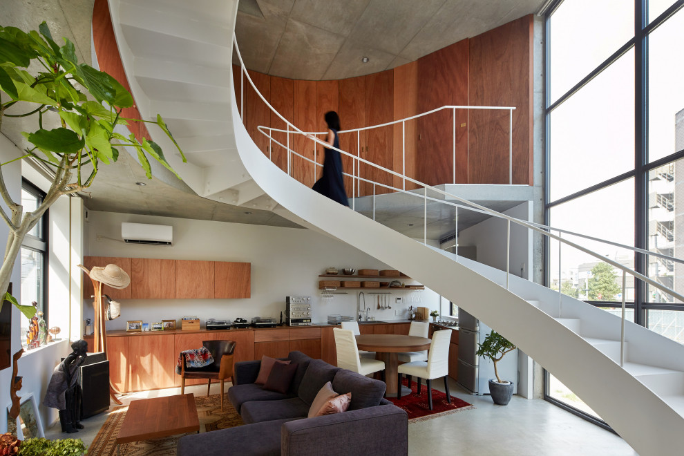 Urban curved metal railing and wood wall staircase photo in Tokyo