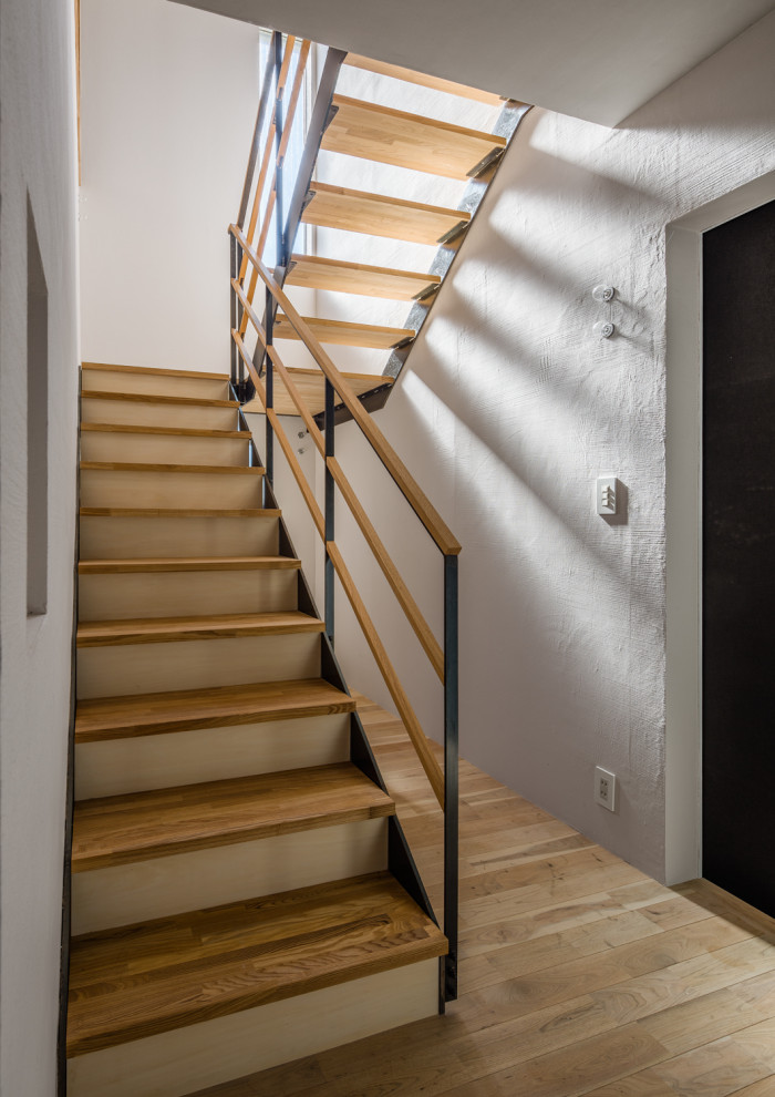 Staircase - mid-sized zen wooden u-shaped mixed material railing staircase idea in Other with wooden risers
